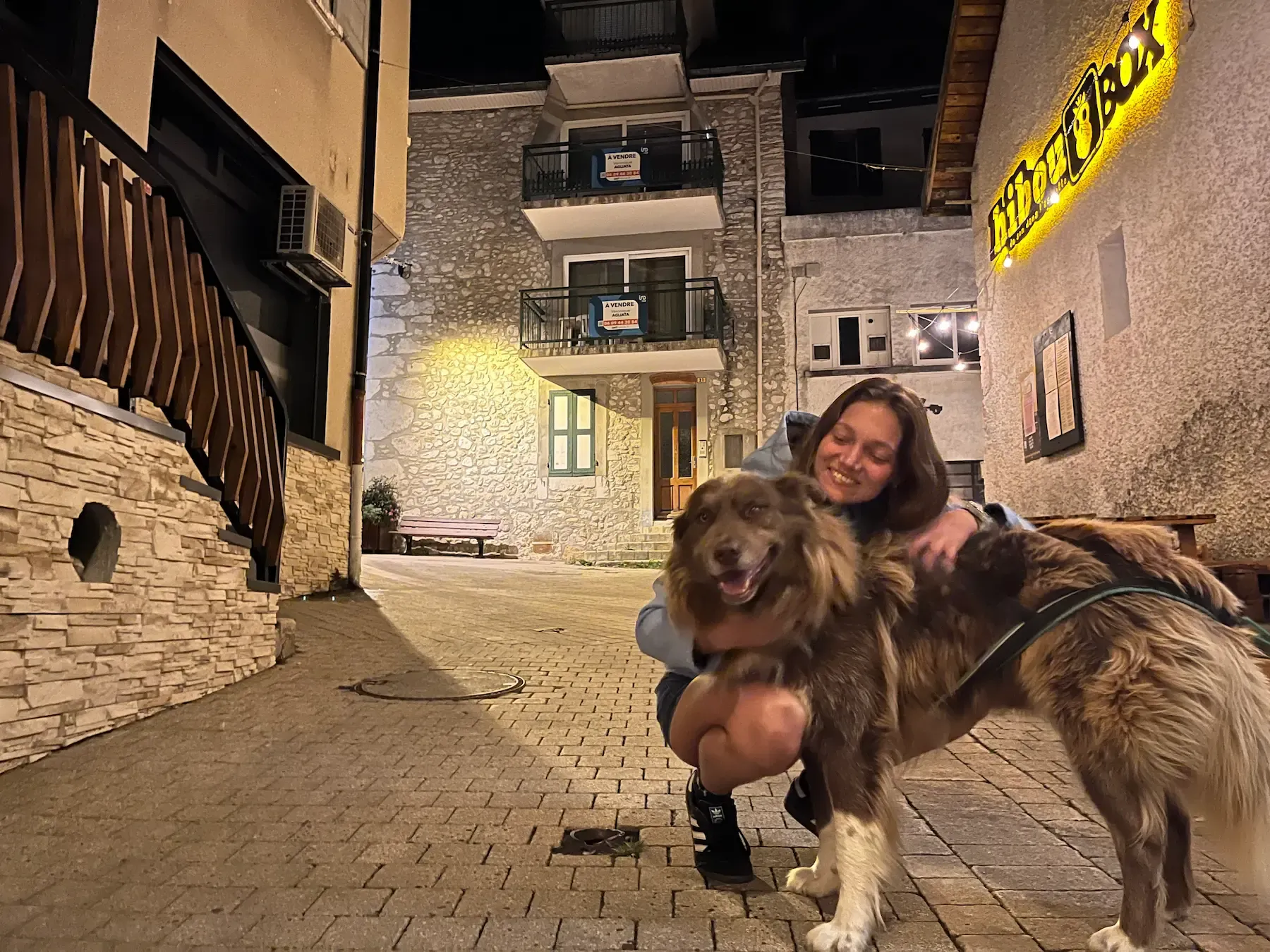 Emily hugging a dog she looked after