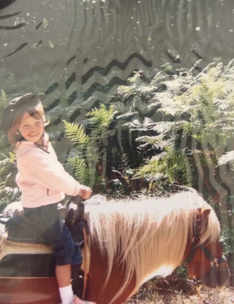 Young Emily riding a pony